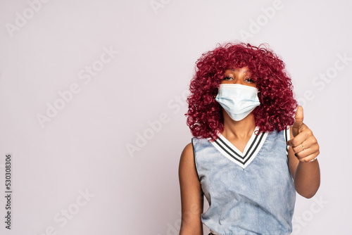 young black woman wearing a face mask