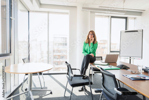 Businesswoman having a call at the office