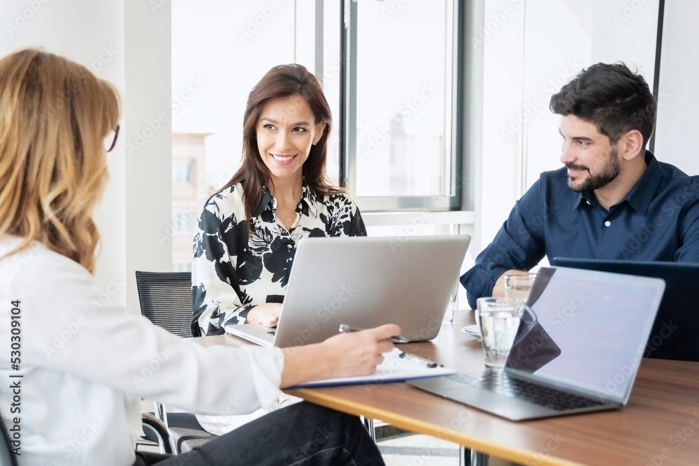 Business people working together in a boardroom Business people working together in a boardroom