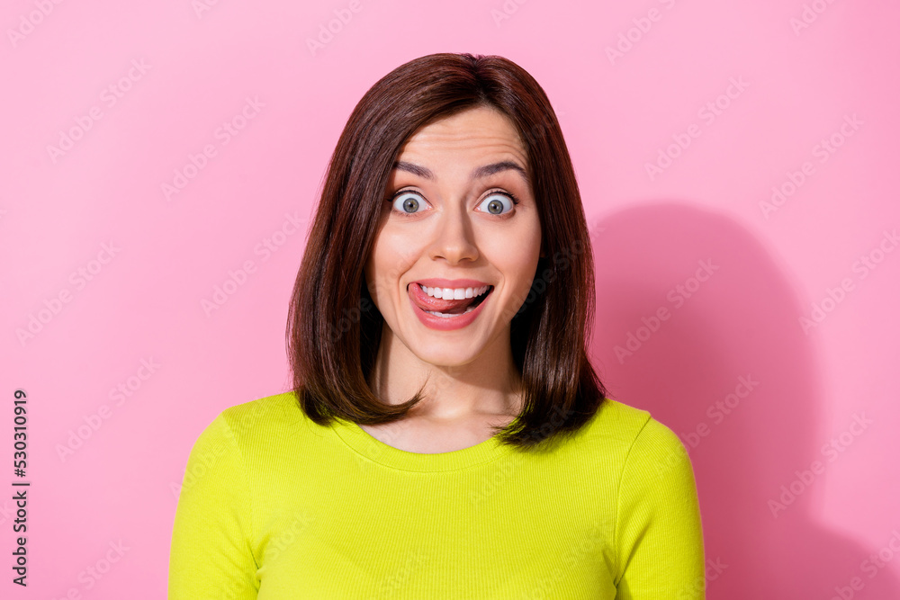 Photo of astonished positive pretty girl lick teeth beaming smile unbelievable isolated on pink color background Photo of astonished positive pretty girl lick teeth beaming smile unbelievable isolated on pink color background