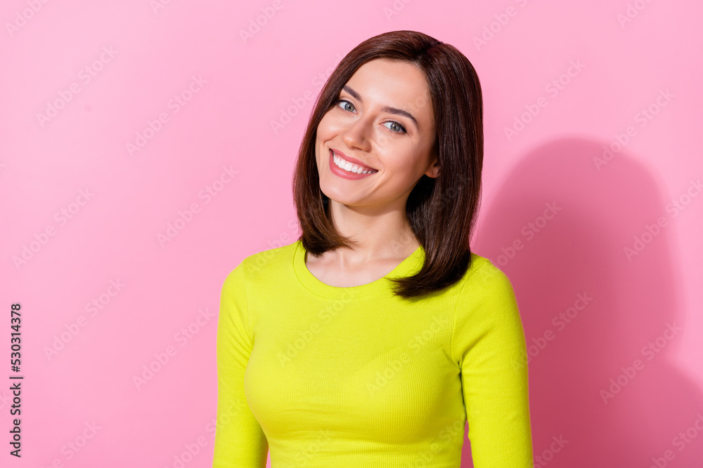 Photo of charming satisfied girl toothy smile look camera isolated on pastel pink color background Photo of charming satisfied girl toothy smile look camera isolated on pastel pink color background