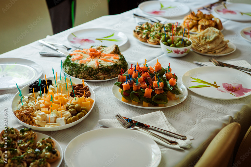 decorated festive table with ready-made dishes