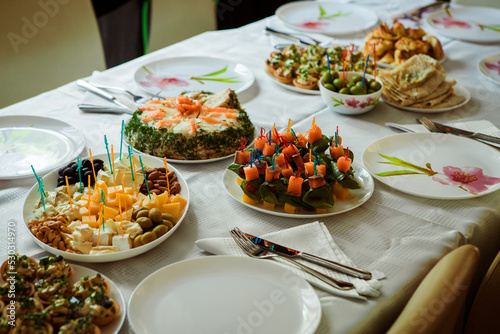 decorated festive table with ready-made dishes