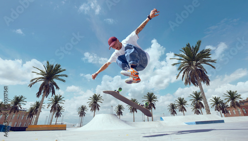 Skateboarder doing a trick in a skate park