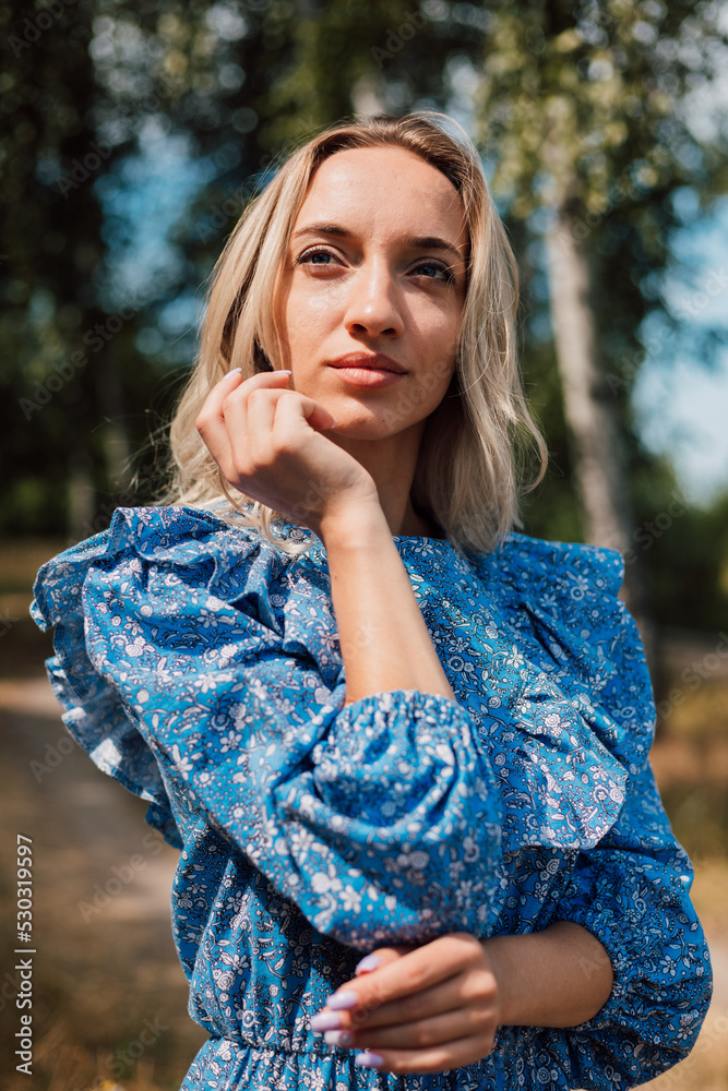 Portrait of a young beautiful blonde woman in the forest in nature Portrait of a young beautiful blonde woman in the forest in nature