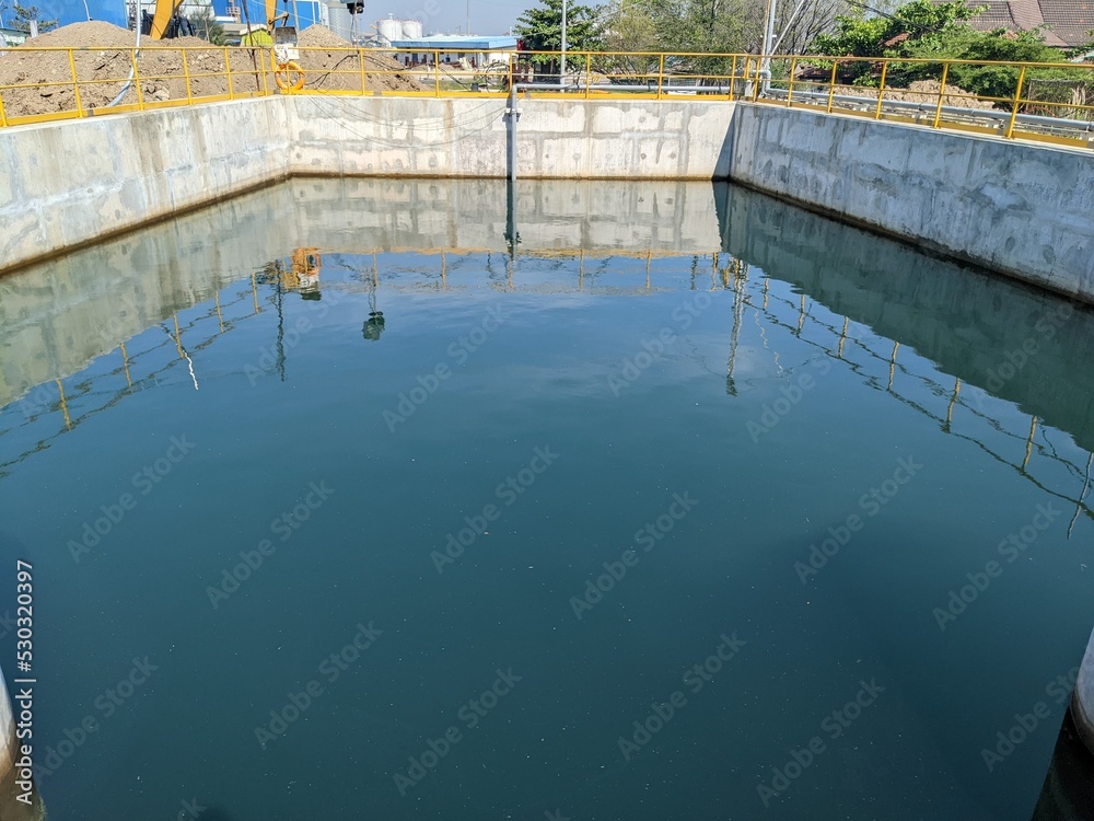 Landscape photo of water pond on the seawater intake head. The photo is perfect for construction photo background, poster industry and pamphlet.