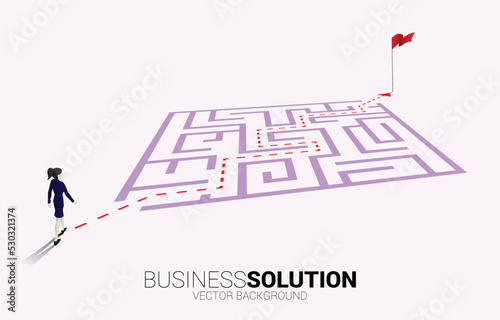 Silhouette of businesswoman with route path to exit the maze. Business concept for problem solving and finding idea.