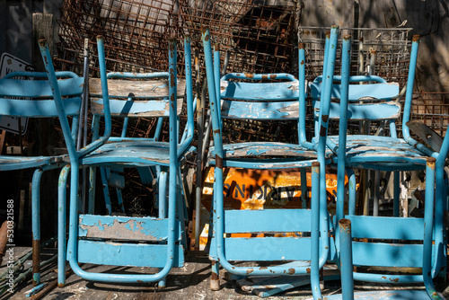 Vintage blue chairs in a backyard