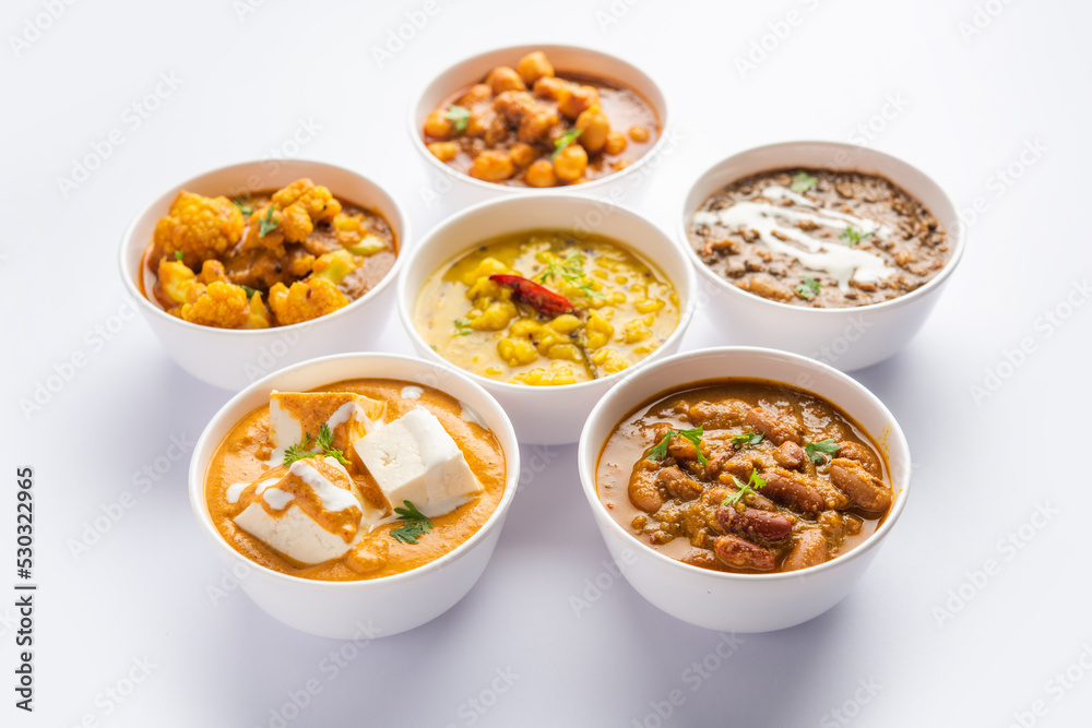 Group of Indian vegetarian dishes, hot and spicy Punjabi cuisine meal assortment in bowls
