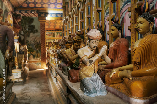 Old sculptures of praying Buddhists in Sri Lanka. High quality photo