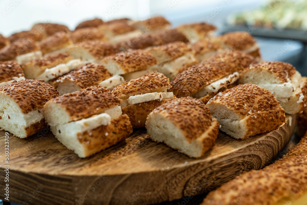 coffee break hotel during conference meeting, corporate revent with tea and coffee catering, decorated catering banquet table with variety of different pastry and bakery, with croissants and cookies