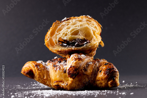Image of croissants with chocolate on dark grey surface