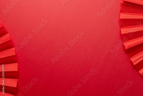 Composition of traditional chinese fans on red background