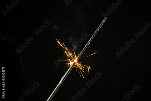 Composition of close up of new years sparkler on black background