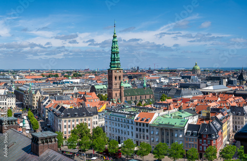 Panorama view Copenhagen, Denmark skyline from Christiansborg Palace tower. Aerial view of roofs and cityscape on a sunny day with the towers of the most important sightseeing spots