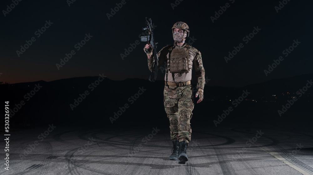 Army soldier in Combat Uniforms with an assault rifle, plate carrier ...
