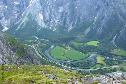 Family with children and dog, hiking in Litlefjellet on sunset, enjoying amazing view from the top of hiking trail photo