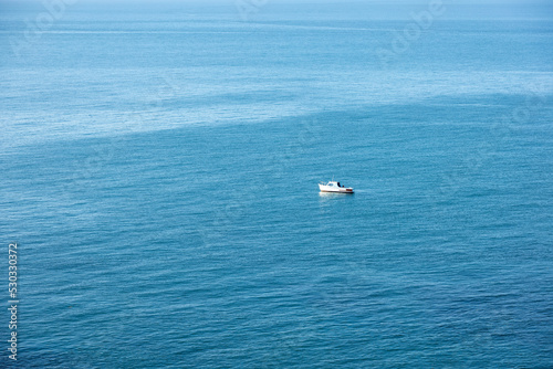 lone boat on the sea © SeanMichaelPritchard