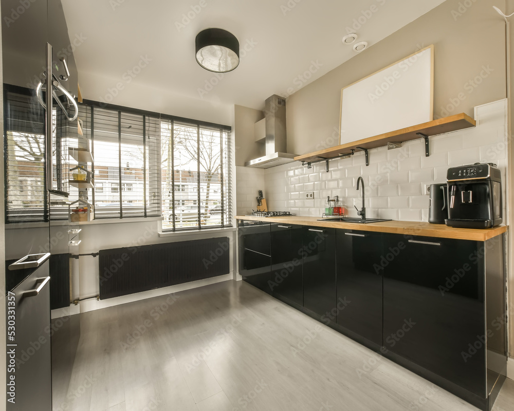 Modern kitchen with black cabinets Modern kitchen with black cabinets