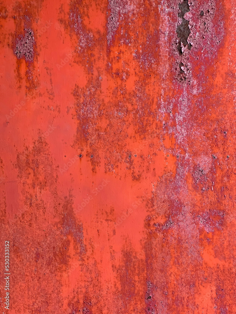 Peeled red paint on the iron background Peeled red paint on the iron background