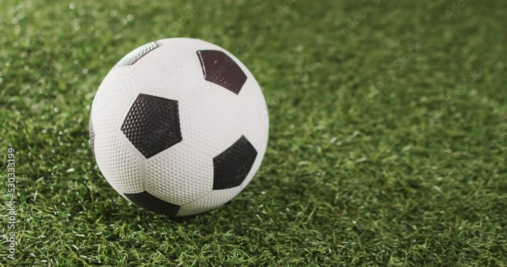 Animation of football over grass with copy space Animation of football over grass with copy space