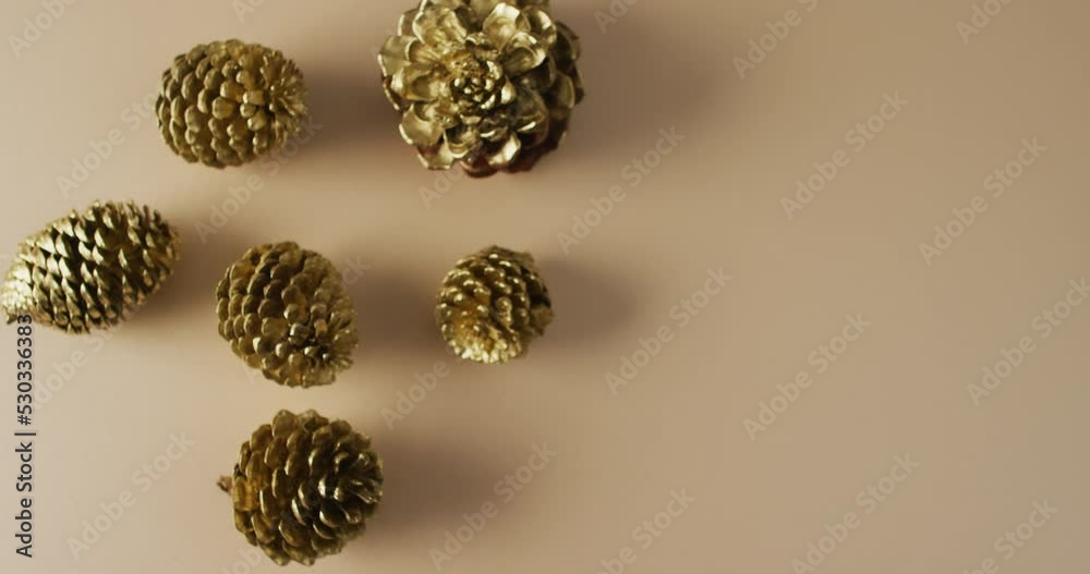 Video of pine cones lying on beige surface Video of pine cones lying on beige surface