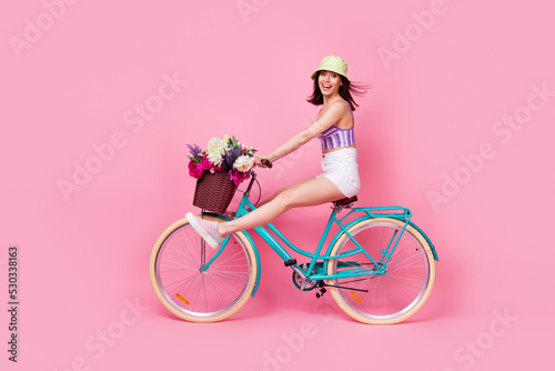 Fotografie, Tablou Full length photo of charming impressed lady wear purple bra riding bicycle empt