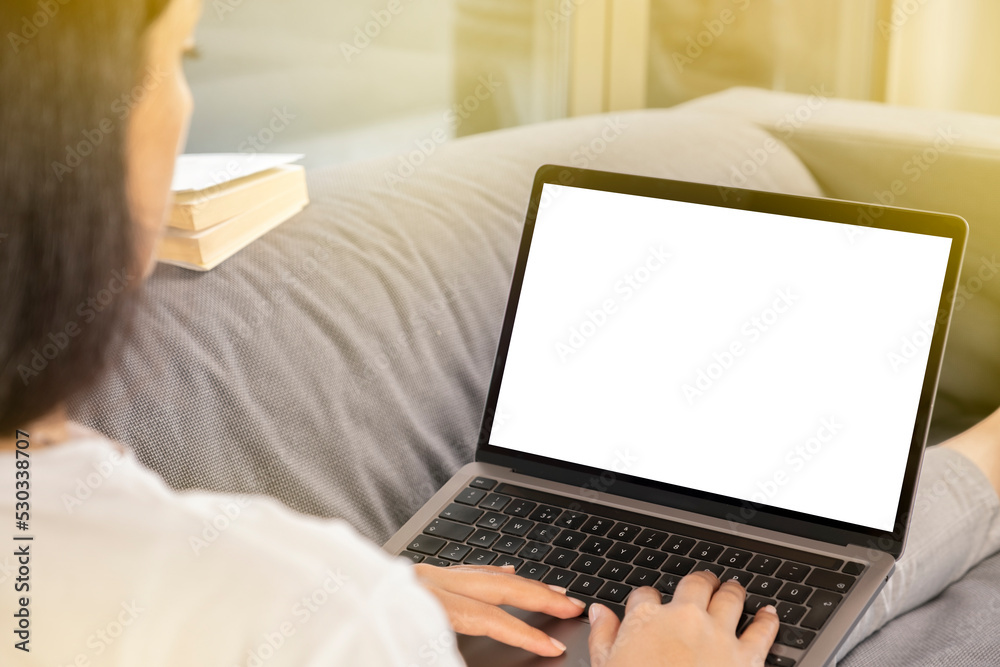 Work at home, young brunette woman work at home. Holding modern laptop for mock up, blank white screen. Hands on keyboard typing, browsing, designing, coding. Morning light with copy space area. Work at home, young brunette woman work at home. Holding modern laptop for mock up, blank white screen. Hands on keyboard typing, browsing, designing, coding. Morning light with copy space area.