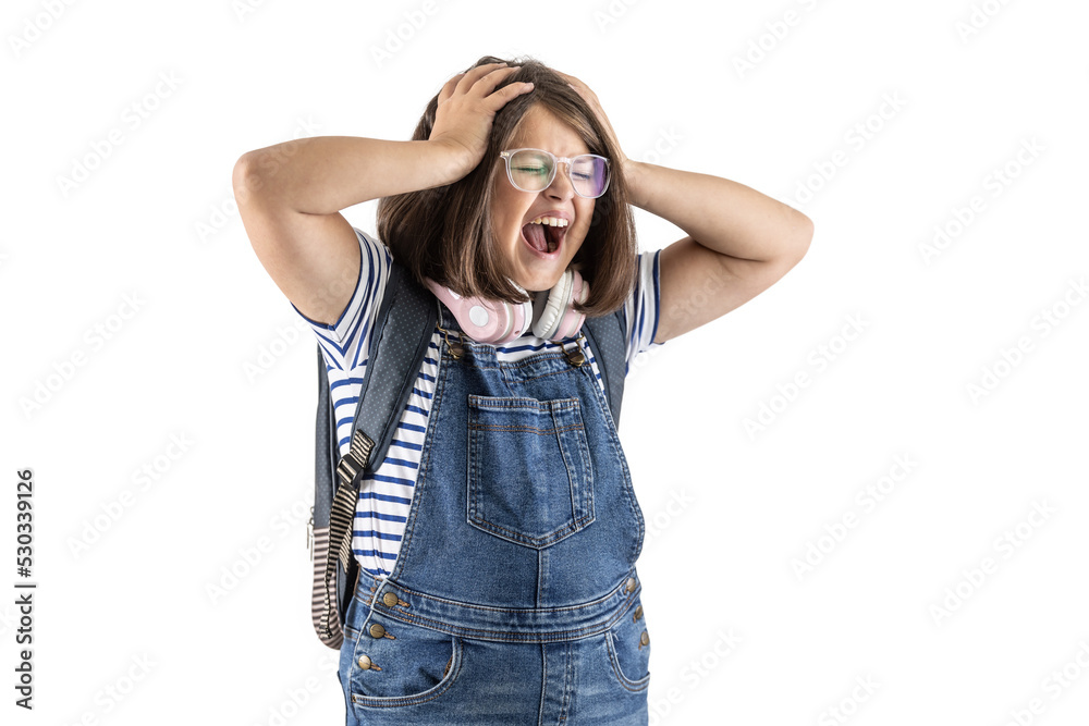 Schoolgirl with backpack and glasses holds her with both hands screaming out loud Schoolgirl with backpack and glasses holds her with both hands screaming out loud