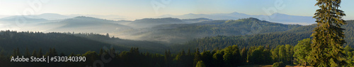 Fotografie, Obraz Sun rising over the mountains; panoramic view