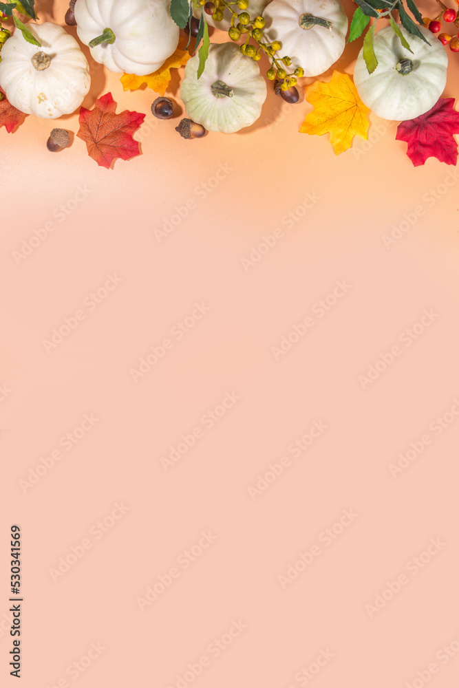 Autumn decorative pumpkins with fall leaves on beige background. Fall Thanksgiving halloween holiday greeting card background, harvest concept. Top view, copy space