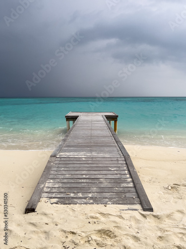 Wooden pier leading to the ocean