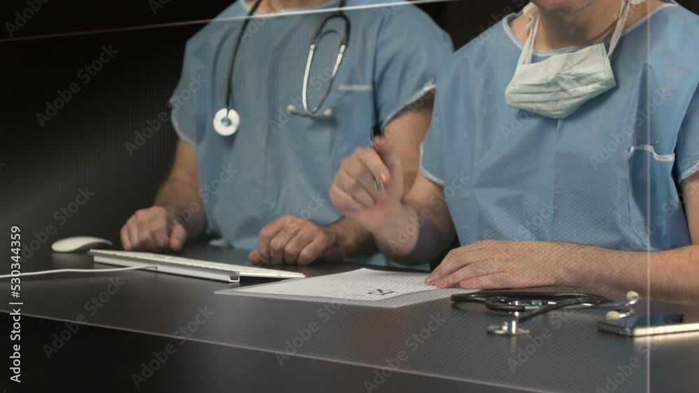 doctor working in hospital on touch screen