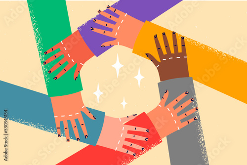 Diverse people hold hands in circle 
