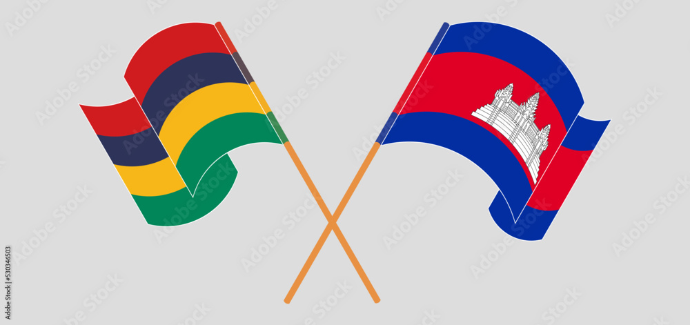 Crossed and waving flags of Mauritius and Cambodia