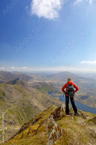 Wales young female hiker with backpack enjoying success