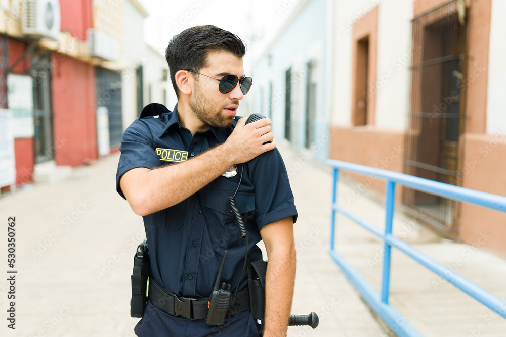 Busy policeman reporting a crime to the police station Busy policeman reporting a crime to the police station