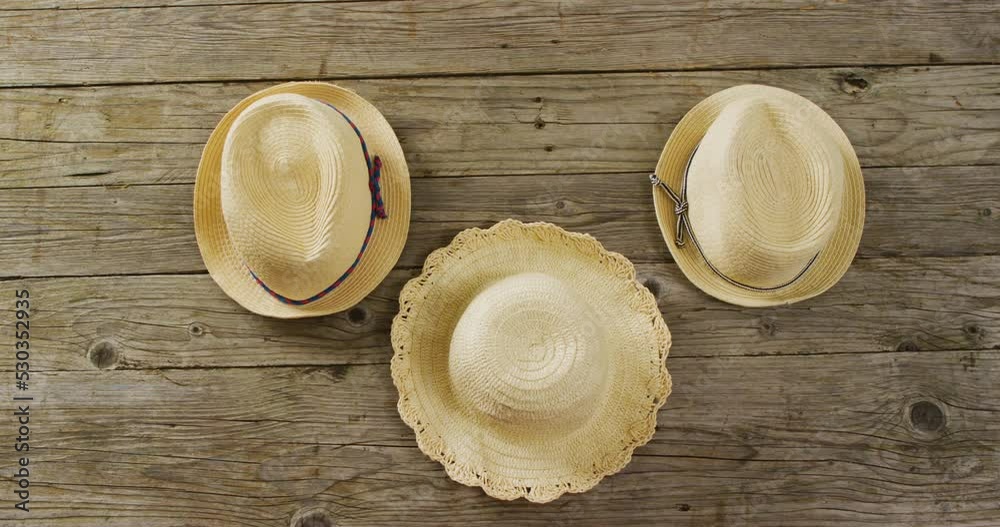 Video of close up of hats on wooden background Video of close up of hats on wooden background