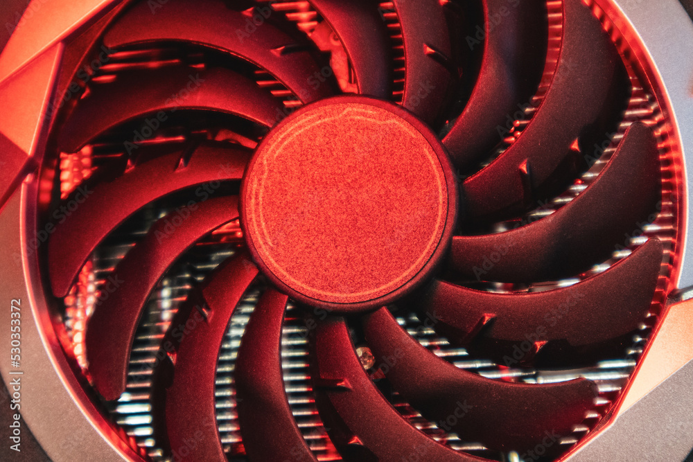 Fototapeta premium Cooler fan on Gpu graphics card close in red light