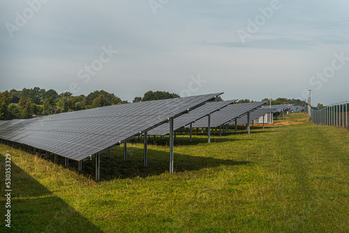 Generating clean energy with solar panels in a large park in Germany Bavaria. Renewable energy through solar panels to generate clean energy.