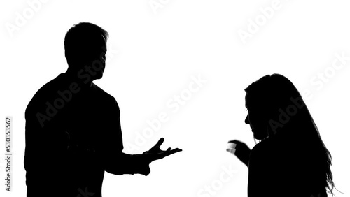 silhouette of couple arguing photo