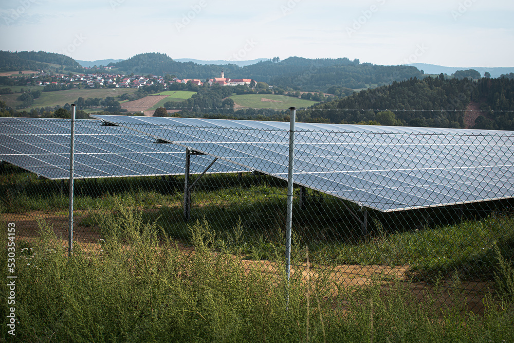 Generating clean energy with solar panels in a large park in Germany Bavaria. Renewable energy through solar panels to generate clean energy. Generating clean energy with solar panels in a large park in Germany Bavaria. Renewable energy through solar panels to generate clean energy.