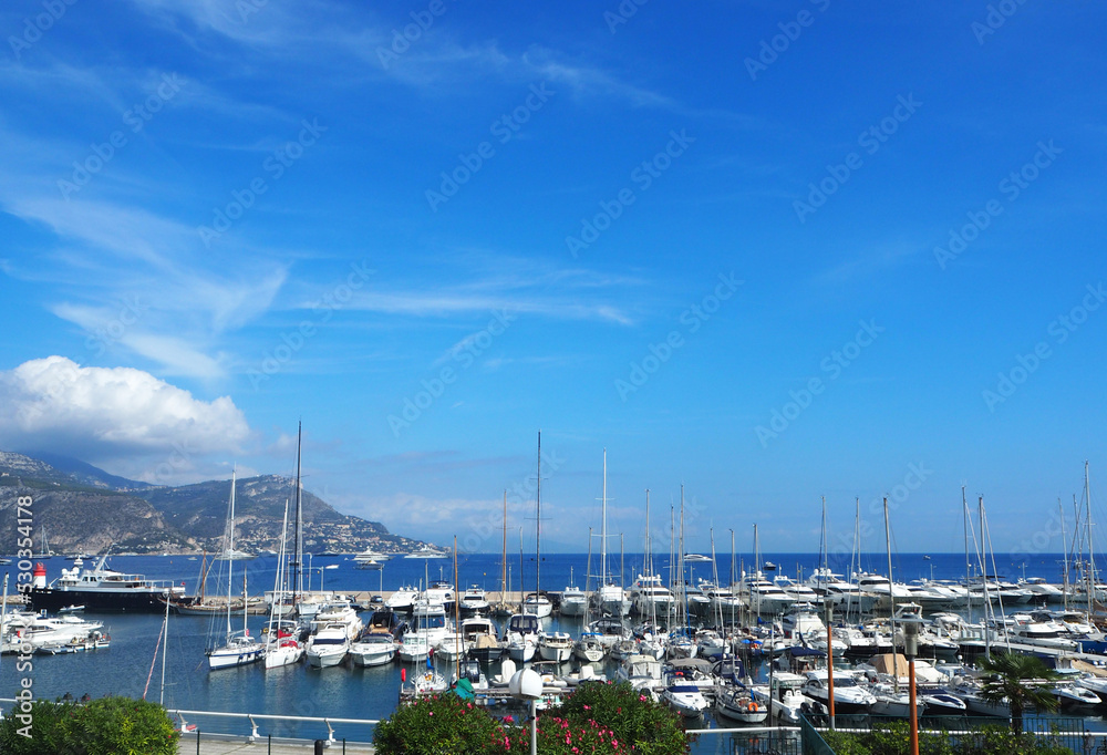 SAINT-JEAN-CAP-FERRAT, FRANCE - SEPTEMBER 2019: Yachts in port of Saint-Jean-Cap-Ferrat - resort and commune in southeast of France on promontory of Cote d'Azur in Provence-Alpes-Cote d'Azur, France