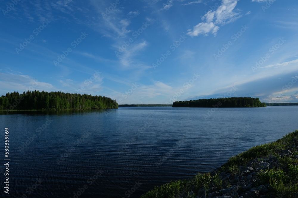 Beautiful blue lake, summertime, wild lake in the forest