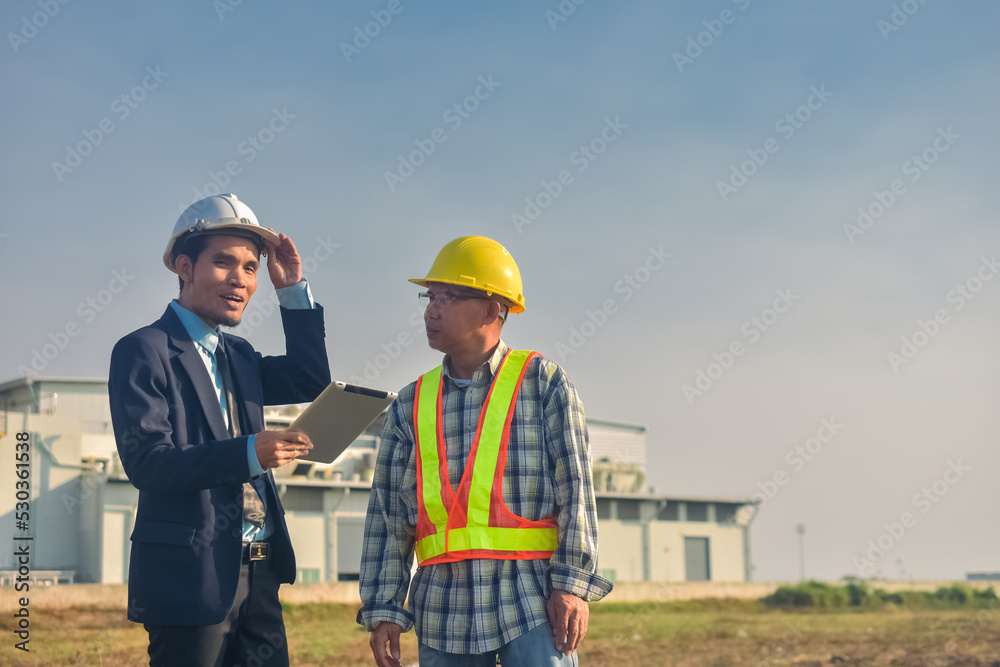 Asian engineer construction team checking work for control and management in the construction site or building site Asian engineer construction team checking work for control and management in the construction site or building site