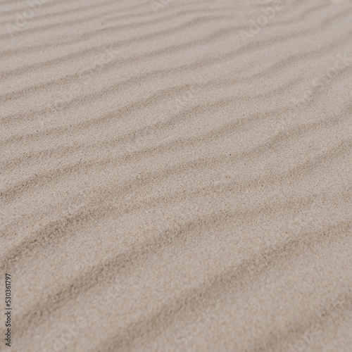 Abstract minimal hot summer vacation texture. Closeup view of beach or desert dune sand waves. Aesthetic neutral colour nature landscape