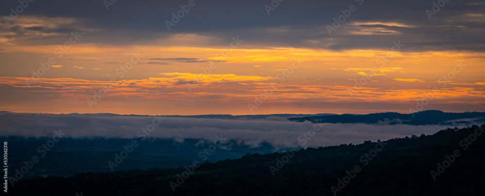 Amazing sunset and sunrise.Very beautiful of morning light, fluffy mist, over the valley.select focus.