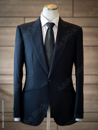 Luxury men fashion blazer black jacket with black tie and white shirt suit displaying on mannequin