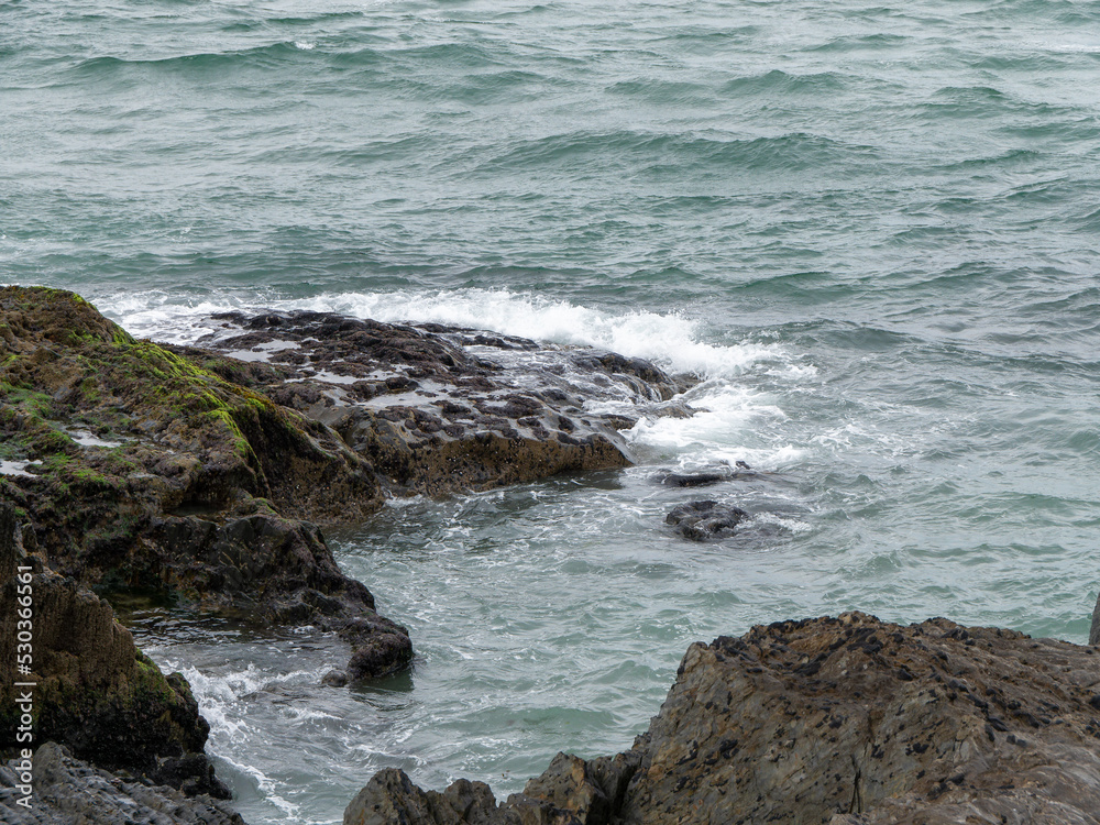 Wild rock, rock formation beside body of water. Ocean waves & Coastal Cliffs Wild rock, rock formation beside body of water. Ocean waves & Coastal Cliffs