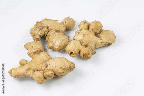 ginger on a white background,yellow fresh ginger laying on a white background